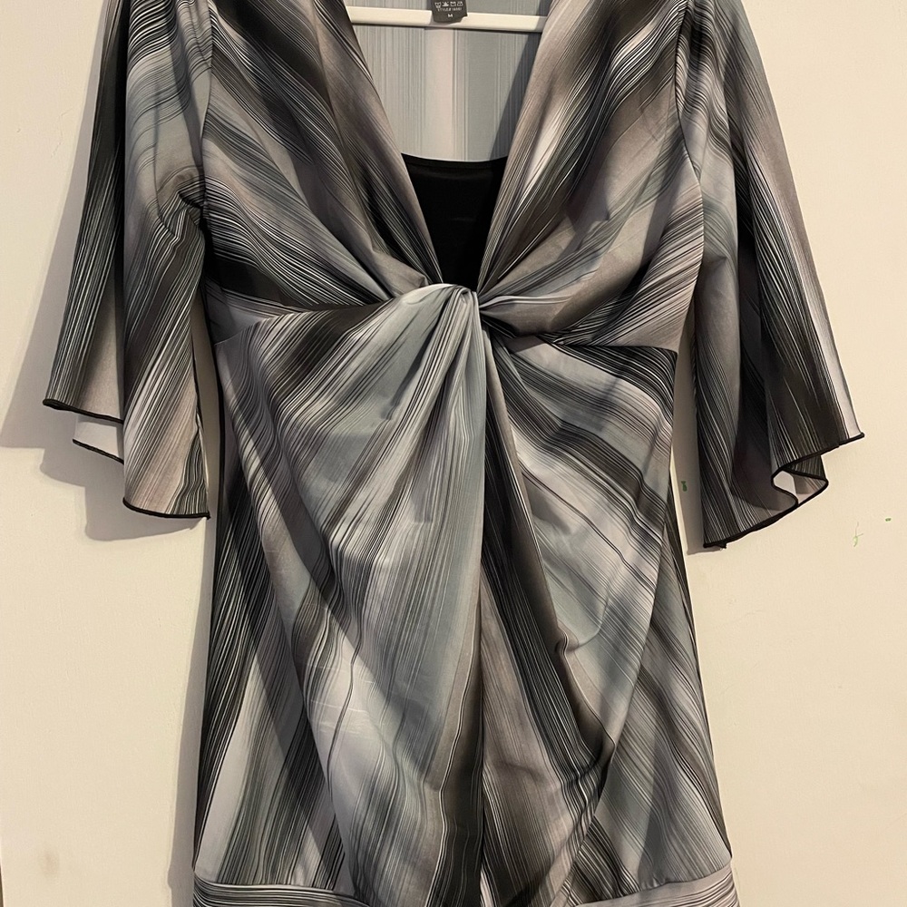 Black and white plaid style blouse, size medium.